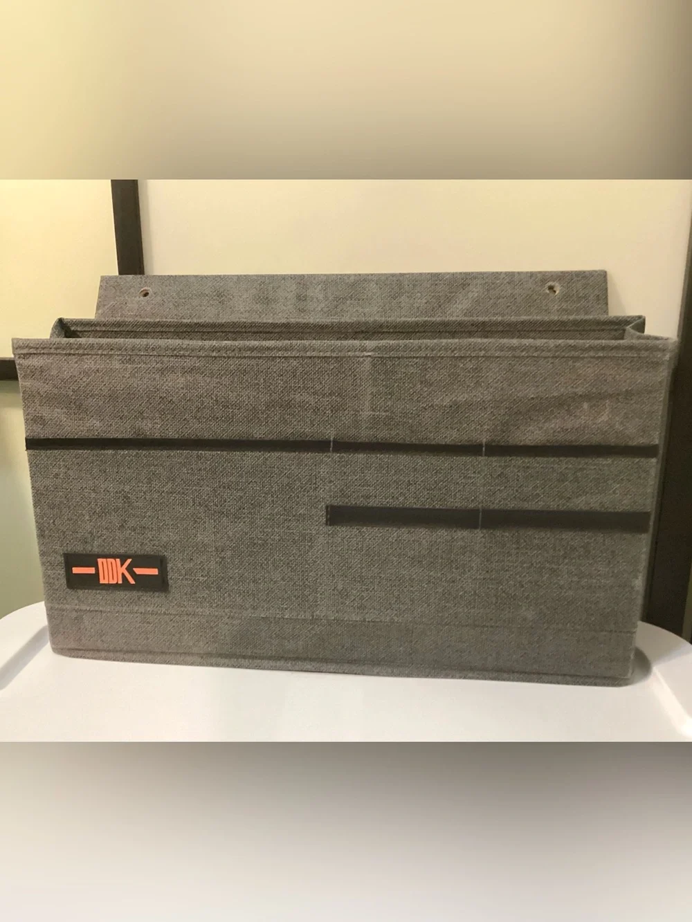 Desk side hanging organizer storage bag with 3 pockets.